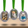 Oval frame christmas tree ornaments with lenticular flip photos of dogs
